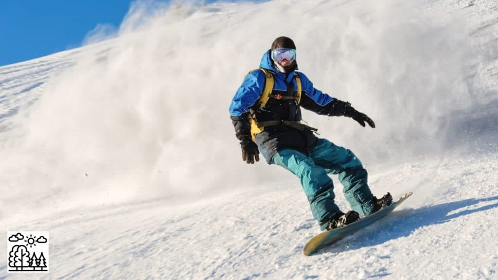 Man practicing snowboarding